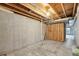 Unfinished basement with concrete walls, exposed ceiling, and some stud framing awaiting customization at 6973 W Louisiana Ave # E, Denver, CO 80232