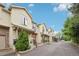 Inviting townhouse exterior showcasing a well-maintained facade and private entrances, nestled in a friendly community at 6973 W Louisiana Ave # E, Denver, CO 80232
