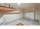 Spacious garage featuring insulated door and ample room for parking and storage at 6973 W Louisiana Ave # E, Denver, CO 80232