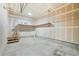 Spacious garage with a concrete floor and open ceiling at 6973 W Louisiana Ave # E, Denver, CO 80232
