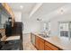 Kitchen boasts stainless steel appliances and an island with a double sink at 6973 W Louisiana Ave # E, Denver, CO 80232