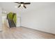 A bright, open living area with laminate flooring, a staircase, and a fresh coat of paint ready for personal touches at 6973 W Louisiana Ave # E, Denver, CO 80232