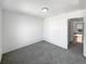 A cozy bedroom features neutral gray carpet and white walls, offering a clean and simple space at 960 Milo Cir # B, Lafayette, CO 80026