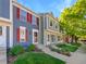 Well-maintained townhome with red shutters and lush landscaping enhancing curb appeal at 960 Milo Cir # B, Lafayette, CO 80026
