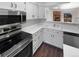 Well-maintained kitchen with modern appliances, white cabinetry, and an open layout at 960 Milo Cir # B, Lafayette, CO 80026