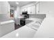 Bright and functional kitchen with white cabinetry and modern appliances at 960 Milo Cir # B, Lafayette, CO 80026