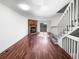 Clean and modern living room featuring a brick fireplace, wood floors, and backyard access at 960 Milo Cir # B, Lafayette, CO 80026