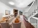Bright living room with a cozy fireplace, plush furniture, and access to the backyard at 960 Milo Cir # B, Lafayette, CO 80026