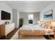 Serene main bedroom with modern decor, a large window, and ample natural light at 960 Milo Cir # B, Lafayette, CO 80026