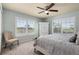 Bedroom with chair, ample natural light, and neutral color scheme that enhances a relaxing atmosphere at 8318 Devinney Ct, Arvada, CO 80005