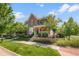 Attractive two-story home featuring a well-manicured lawn and inviting curb appeal at 8318 Devinney Ct, Arvada, CO 80005