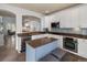 Well-appointed kitchen features stainless steel appliances, granite countertops, and an island at 8318 Devinney Ct, Arvada, CO 80005