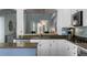 Bright kitchen featuring stainless steel appliances, granite counters, and open layout at 8318 Devinney Ct, Arvada, CO 80005