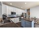Modern kitchen with stainless steel appliances, granite countertops, and stylish island at 8318 Devinney Ct, Arvada, CO 80005