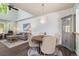 Open-concept living room boasts high ceilings, modern lighting, and a comfortable seating area at 8318 Devinney Ct, Arvada, CO 80005