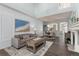 Elegant living room featuring modern decor, a comfortable sofa, and plenty of natural light at 8318 Devinney Ct, Arvada, CO 80005