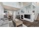 Bright and airy living room with a fireplace, high ceilings, and stylish furnishings at 8318 Devinney Ct, Arvada, CO 80005
