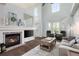 Cozy living room showcasing a fireplace, comfortable seating, and a welcoming atmosphere at 8318 Devinney Ct, Arvada, CO 80005