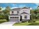 Charming two-story home with gray siding, stone accents, manicured lawn, and attached two car garage at 1431 Lumber Ridge N Cir, Erie, CO 80516