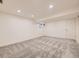 Finished basement has neutral carpet and recessed lighting, and a small window at 2949 Shady Holw, Boulder, CO 80304