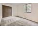 Bright bedroom features neutral carpet, a window, and a closet for ample storage at 2949 Shady Holw, Boulder, CO 80304