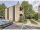 Exterior view of a two-story condo with private balcony, chimney, and assigned parking space at 2949 Shady Holw, Boulder, CO 80304