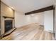 Spacious living room featuring hardwood floors, a fireplace, and exposed ceiling beams at 2949 Shady Holw, Boulder, CO 80304