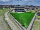 View of a spacious backyard bordered by a wooden fence at 22593 E Piccolo Way, Aurora, CO 80016