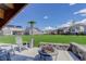 A backyard featuring lawn chairs and a patio heater at 22593 E Piccolo Way, Aurora, CO 80016