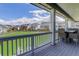 View from covered patio of open green space, with neighboring homes and blue sky backdrop at 22593 E Piccolo Way, Aurora, CO 80016
