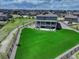 Aerial view of a large home featuring an expansive green yard at 22593 E Piccolo Way, Aurora, CO 80016