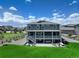Aerial view of home featuring outdoor seating, hot tub, and back deck at 22593 E Piccolo Way, Aurora, CO 80016
