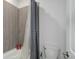 Modern bathroom featuring a bathtub with tiled walls at 22593 E Piccolo Way, Aurora, CO 80016