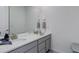 Bright bathroom with a double sink vanity and a large mirror at 22593 E Piccolo Way, Aurora, CO 80016