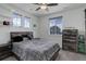 Cozy bedroom with natural light, a wooden bed frame, and warm accents at 22593 E Piccolo Way, Aurora, CO 80016