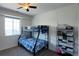 A bedroom with a metal bunk bed and a shelving unit at 22593 E Piccolo Way, Aurora, CO 80016