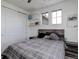 Comfortable bedroom featuring a wooden bed frame, and a closet at 22593 E Piccolo Way, Aurora, CO 80016