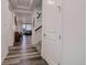 Bright entryway with wood floors leading to an open living space and staircase at 22593 E Piccolo Way, Aurora, CO 80016