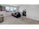 Comfortable living room with large windows offering natural light and a cozy seating area at 22593 E Piccolo Way, Aurora, CO 80016
