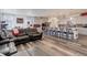 Spacious open-concept living room seamlessly connects to a modern kitchen and dining area at 22593 E Piccolo Way, Aurora, CO 80016