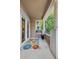 Inviting balcony with a vibrant rug and views of lush greenery at 45 N Ogden St # 201, Denver, CO 80218