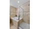 Tiled bathroom featuring a soaking tub and a glass enclosed walk-in shower at 45 N Ogden St # 201, Denver, CO 80218