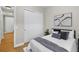 Bedroom featuring a queen-sized bed with sliding door closet at 45 N Ogden St # 201, Denver, CO 80218