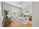 Well-lit bedroom with ceiling fan and accent wall at 45 N Ogden St # 201, Denver, CO 80218