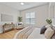 Comfortable bedroom with cozy chair and natural light at 45 N Ogden St # 201, Denver, CO 80218