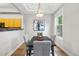 Dining room with modern chandelier, stylish seating, and natural light at 45 N Ogden St # 201, Denver, CO 80218