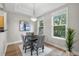 Dining room with modern chandelier, stylish seating, and natural light at 45 N Ogden St # 201, Denver, CO 80218