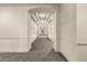 Long hallway featuring elegant lighting and a modern patterned carpet at 45 N Ogden St # 201, Denver, CO 80218
