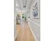 Bright hallway with hardwood floors, arched doorways, and modern decor at 45 N Ogden St # 201, Denver, CO 80218