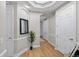 Hallway featuring elegant trimwork, wood floors, and a decorative ceiling at 45 N Ogden St # 201, Denver, CO 80218